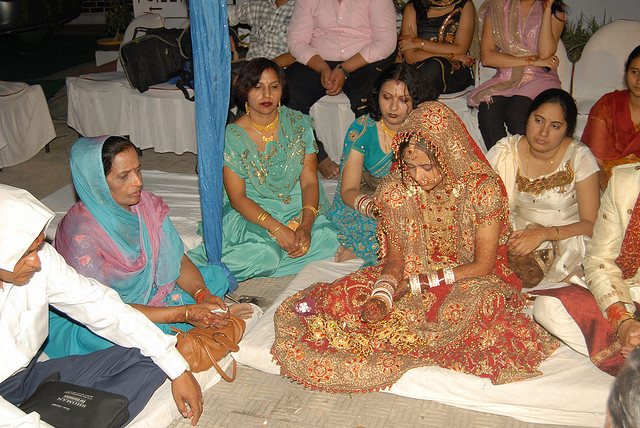 Punjabi Wedding - Father and mother of the bride performing Kanyadan - handing over of their daughter to her husband