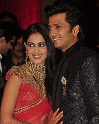 Genelia has worn a Red Sari & Riteish a Sherwani for their Wedding reception