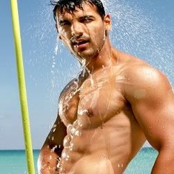 John Abraham without a shirt and under a shower