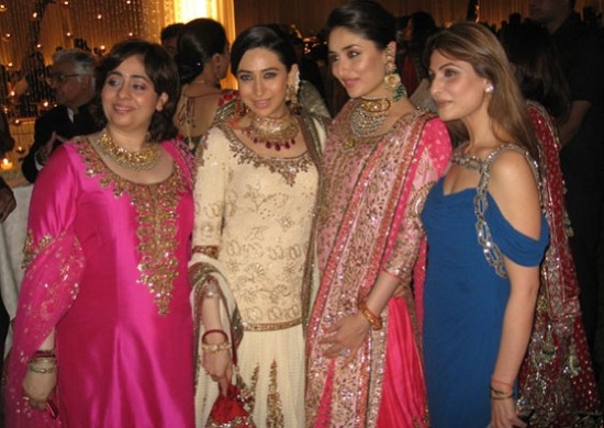 Kareena Kapoor dressed in a Pink Bridal dress with sister Karishma. Pic taken at Saif and Kareena's Marriage Reception in Delhi