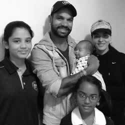 Family photo of Shikhar Dhawan, with his wife, daughters and son.