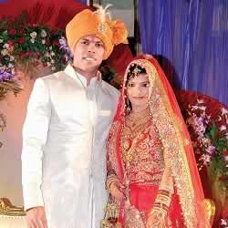 Cricketer Umesh Yadav and wife, Tania Wadhwa, receiving guests at their wedding.
