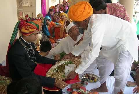 Groom being given gifts at a Marwari and Rajasthan Rajput Wedding.