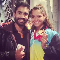 Dipika Pallikal with fiancé, Dinesh Karthik, and her Gold Medal.