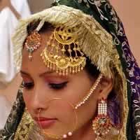 Jhoomar is a big wedding jewellery that is worn on the hair.